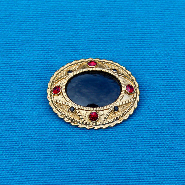 Black Oval with Red Brooch