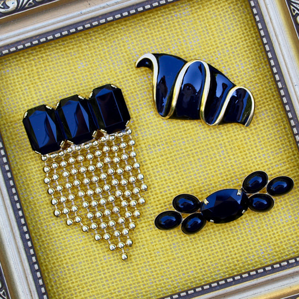 Trio of Black and Gold Brooches