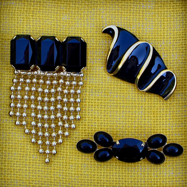 Trio of Black and Gold Brooches