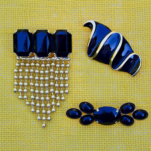 Trio of Black and Gold Brooches